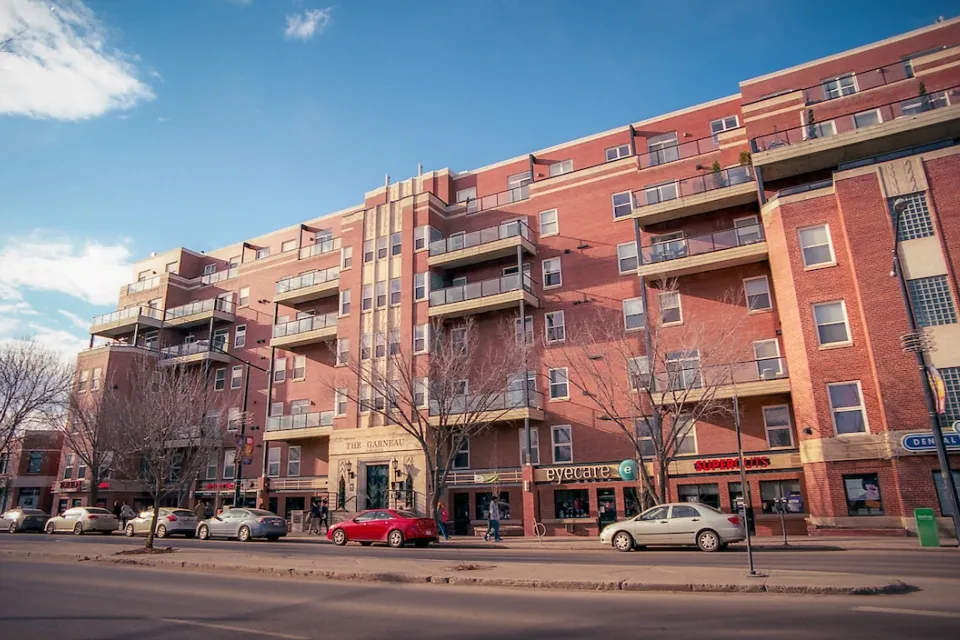 Red brick five-story multifamily housing building in Edmonton, Alberta, Canada.